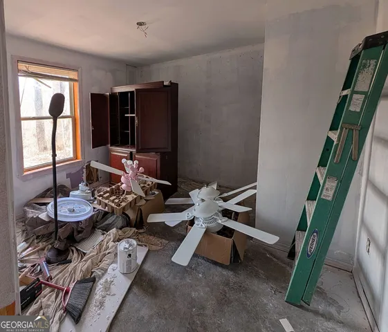 a workspace with furniture and screen