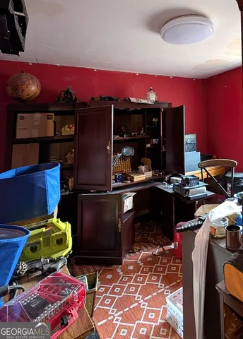 a view of a livingroom with furniture and a flat screen tv