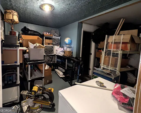 a living room with lots of furniture and a fireplace