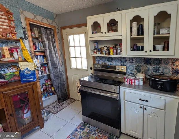 a kitchen with stainless steel appliances granite countertop a stove and a refrigerator