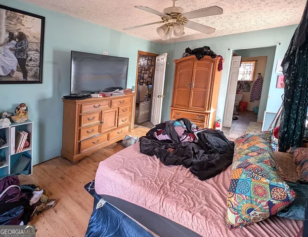 a bedroom with furniture and a window