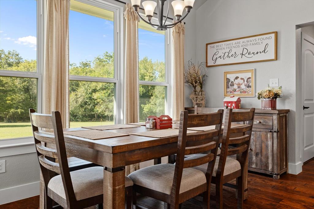 725 Wilson Road Van Alstyne, TX 75495 - Photo 12 of 40 a view of a dining room with furniture window and wooden floor