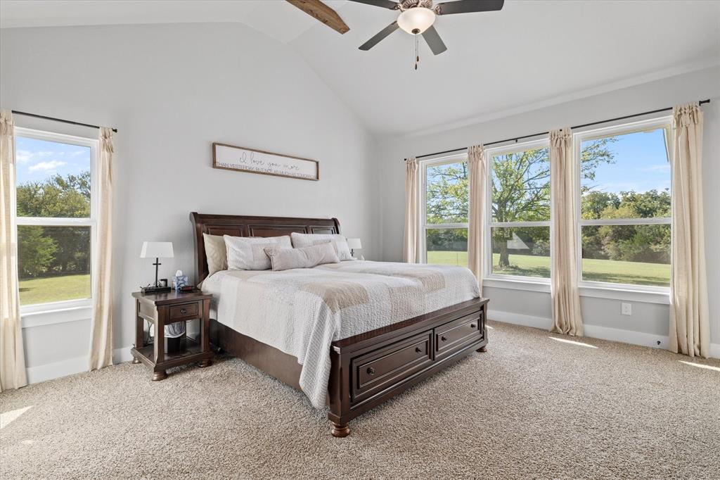 725 Wilson Road Van Alstyne, TX 75495 - Photo 13 of 40 a bed sitting in a room next to a window