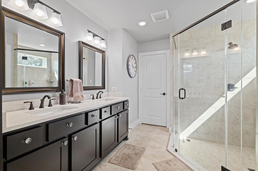 725 Wilson Road Van Alstyne, TX 75495 - Photo 15 of 40 a bathroom with a double vanity sink mirror double and shower