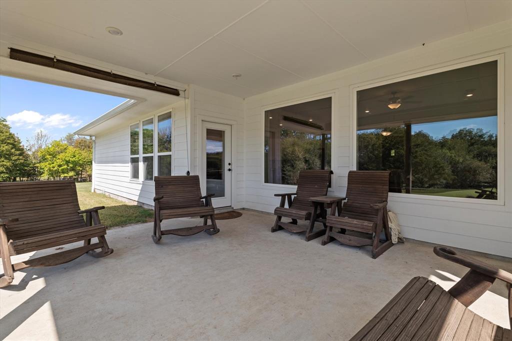 725 Wilson Road Van Alstyne, TX 75495 - Photo 19 of 40 a living room with furniture and a large window
