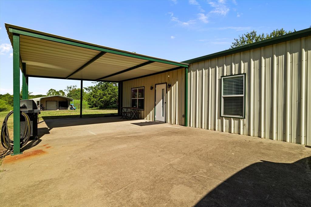 725 Wilson Road Van Alstyne, TX 75495 - Photo 20 of 40 a view of a house with backyard and porch