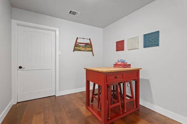 a view of a utility room with closet and windows