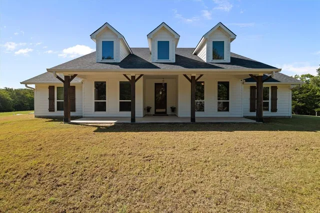 front view of a house with a yard