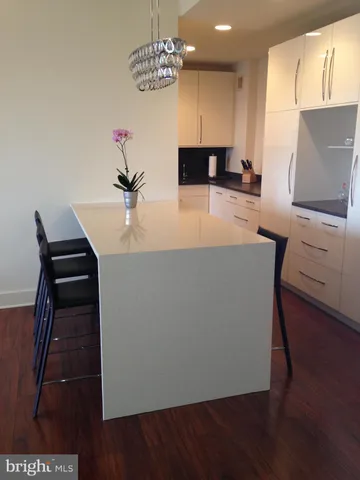a view of kitchen with furniture and wooden floor
