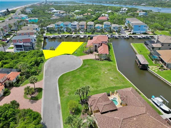 an aerial view of a house with a swimming pool outdoor seating and yard