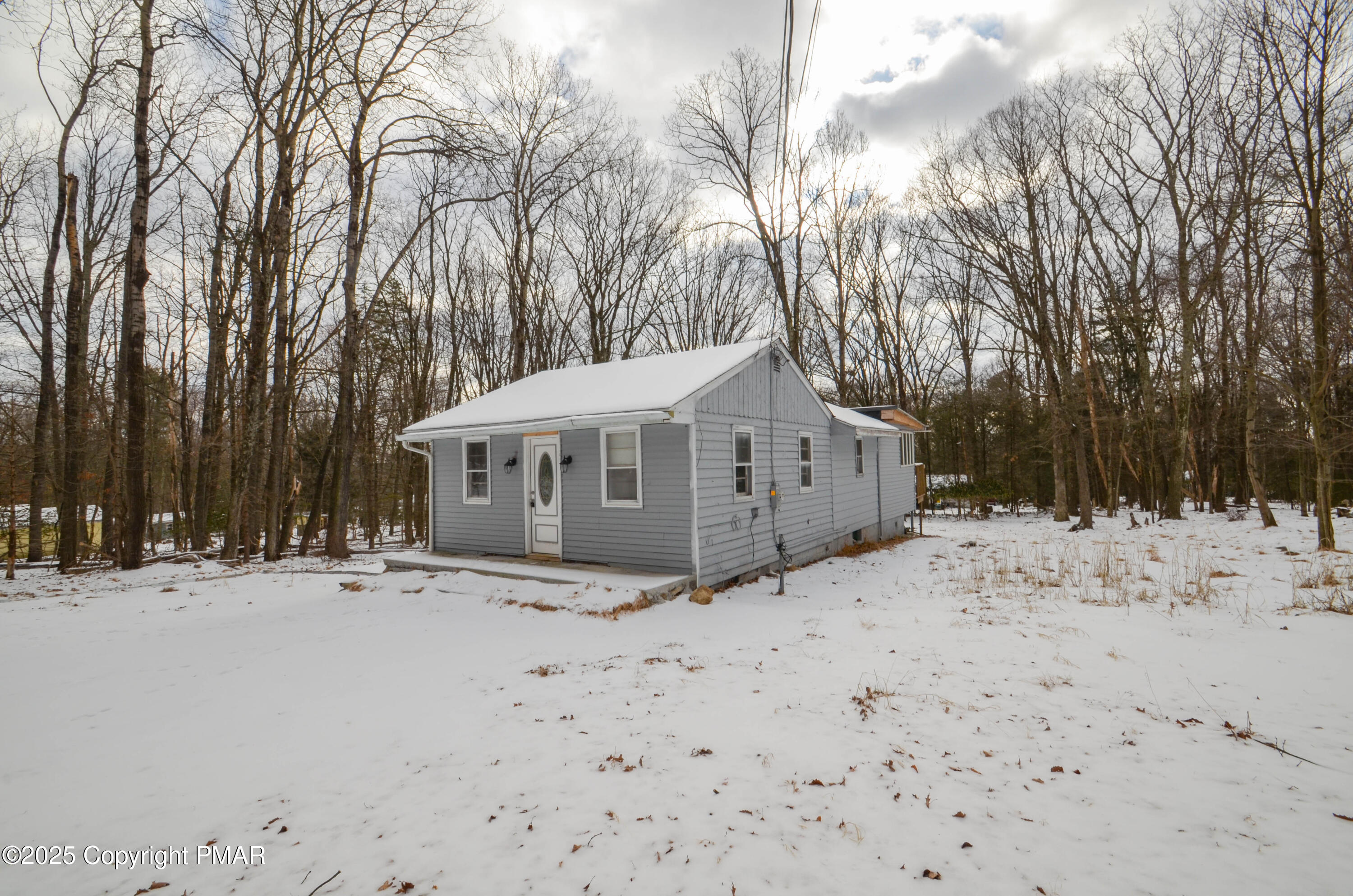 1108 Fir Road Effort, PA 18330 - Photo 1 of 22 a view of a house with a yard covered in snow