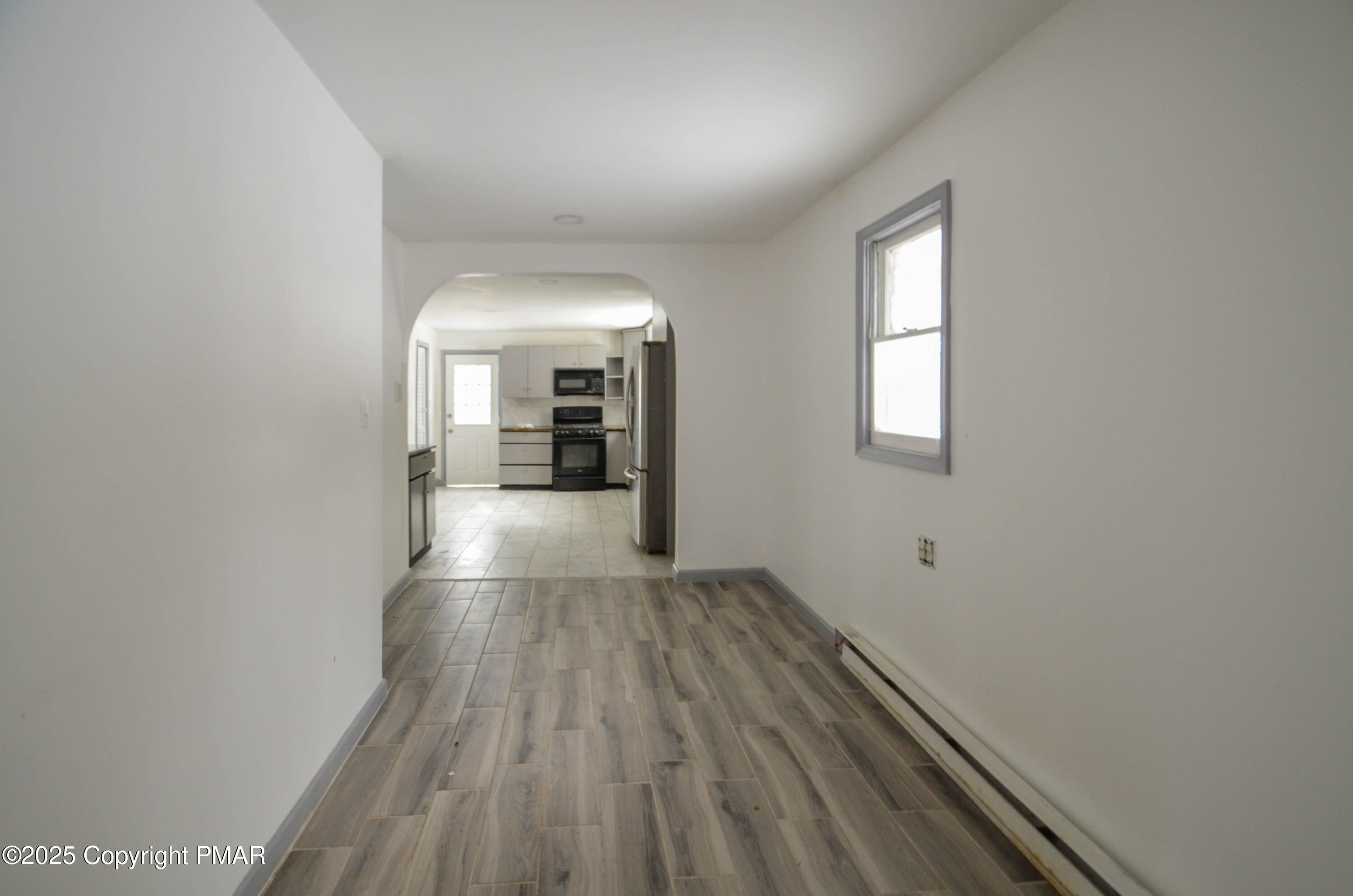1108 Fir Road Effort, PA 18330 - Photo 4 of 22 wooden floor in an empty room with a window