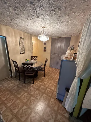 a view of a livingroom with furniture and staircase