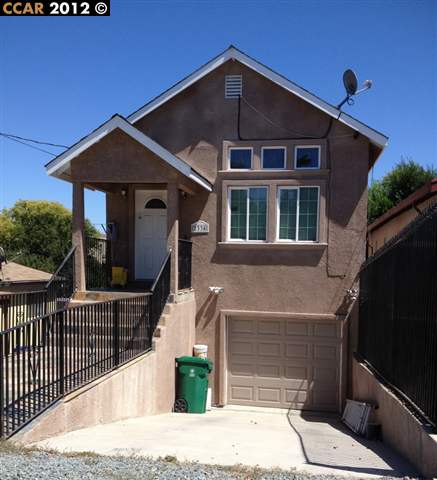233 A Pinole Avenue Rodeo, CA 94572 - Photo 1 of 1 a front view of a house with garage
