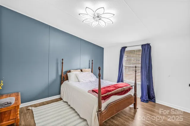 a bedroom with furniture and a chandelier