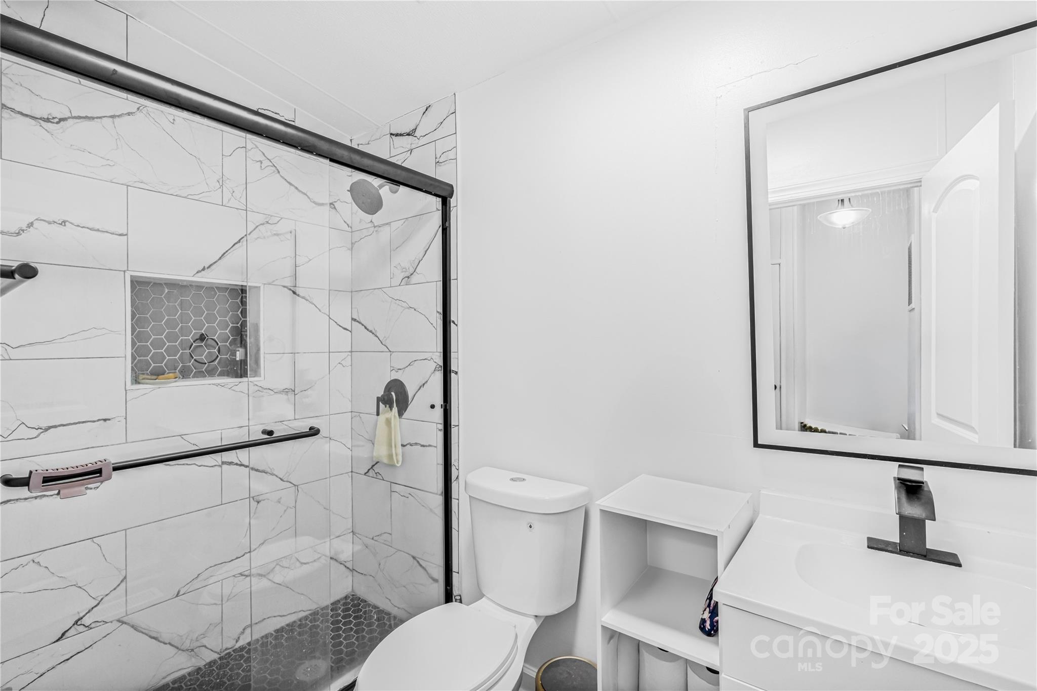 2235 Sandy Ridge Church Road Morven, NC 28119 - Photo 28 of 33 a bathroom with a toilet sink and shower