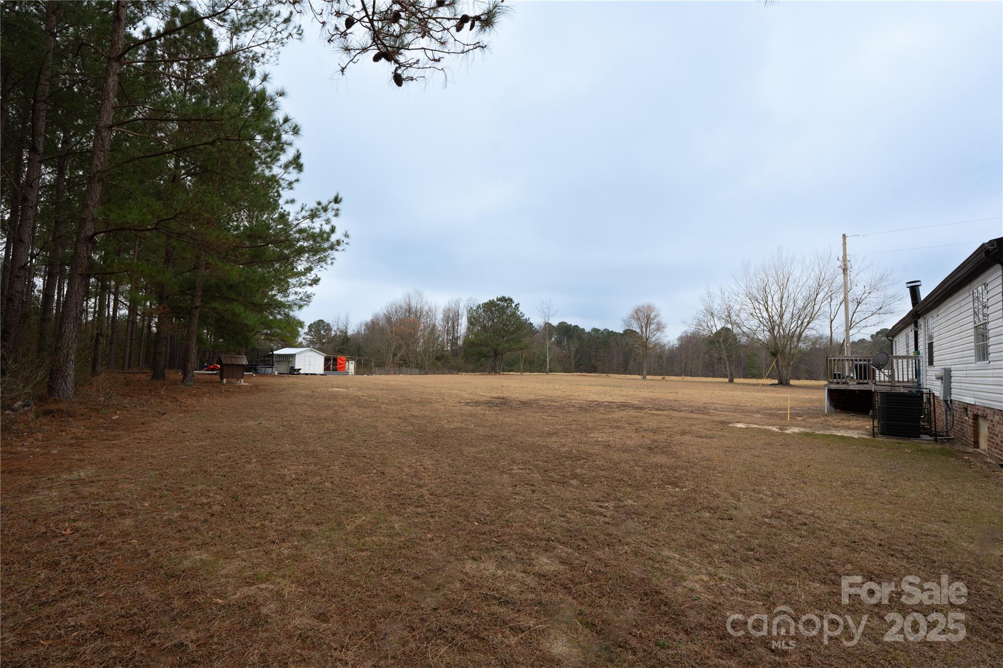 2235 Sandy Ridge Church Road Morven, NC 28119 - Photo 32 of 33 a view of dirt road with a building in the background