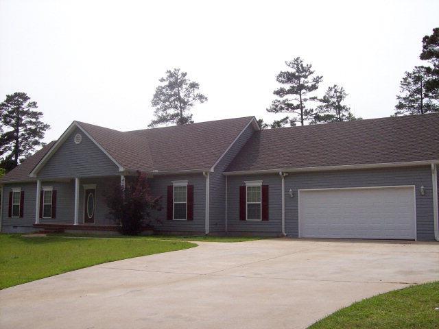 20 Lower Simmons Road Macon, GA 31220 - Photo 1 of 32 a front view of a house with a yard and garage