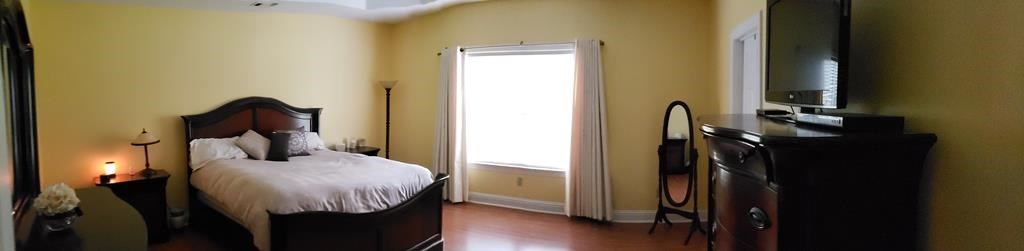 20 Lower Simmons Road Macon, GA 31220 - Photo 11 of 32 a bedroom with a bed next to a window