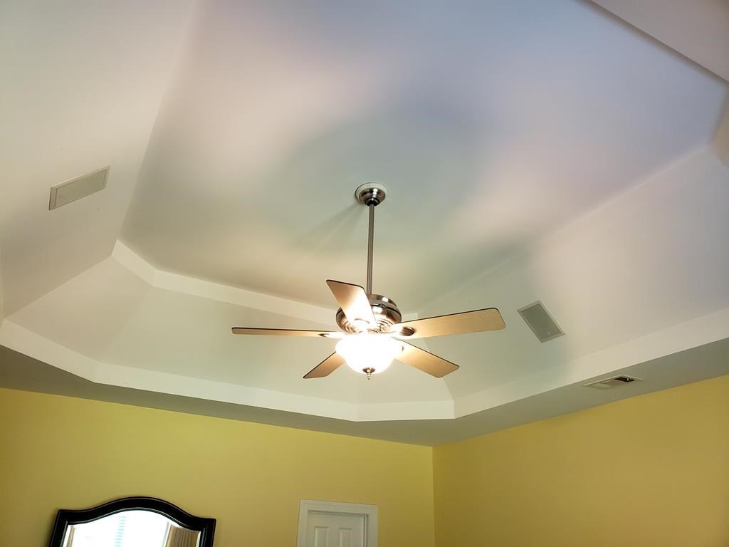 20 Lower Simmons Road Macon, GA 31220 - Photo 12 of 32 a view of a room with a ceiling fan and a chandelier