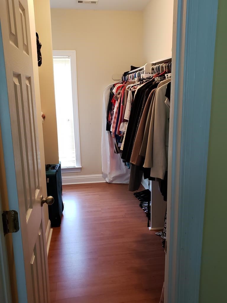 20 Lower Simmons Road Macon, GA 31220 - Photo 15 of 32 a view of walk in closet with clothes and shoes