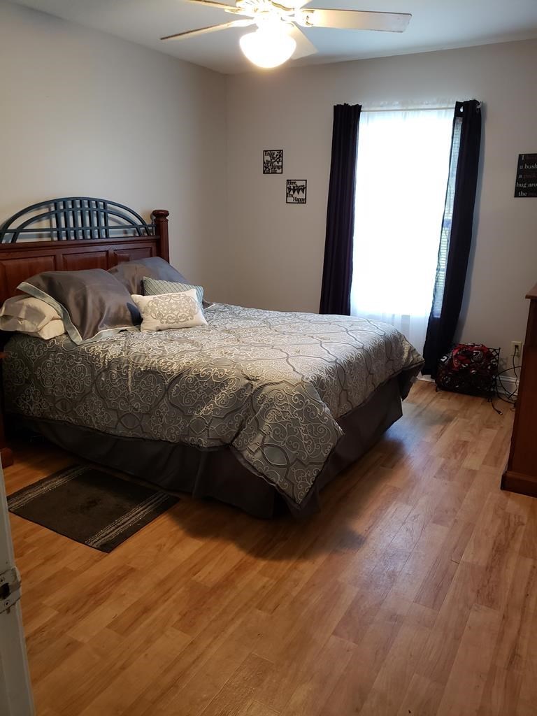 20 Lower Simmons Road Macon, GA 31220 - Photo 21 of 32 a bedroom with a bed and a mirror