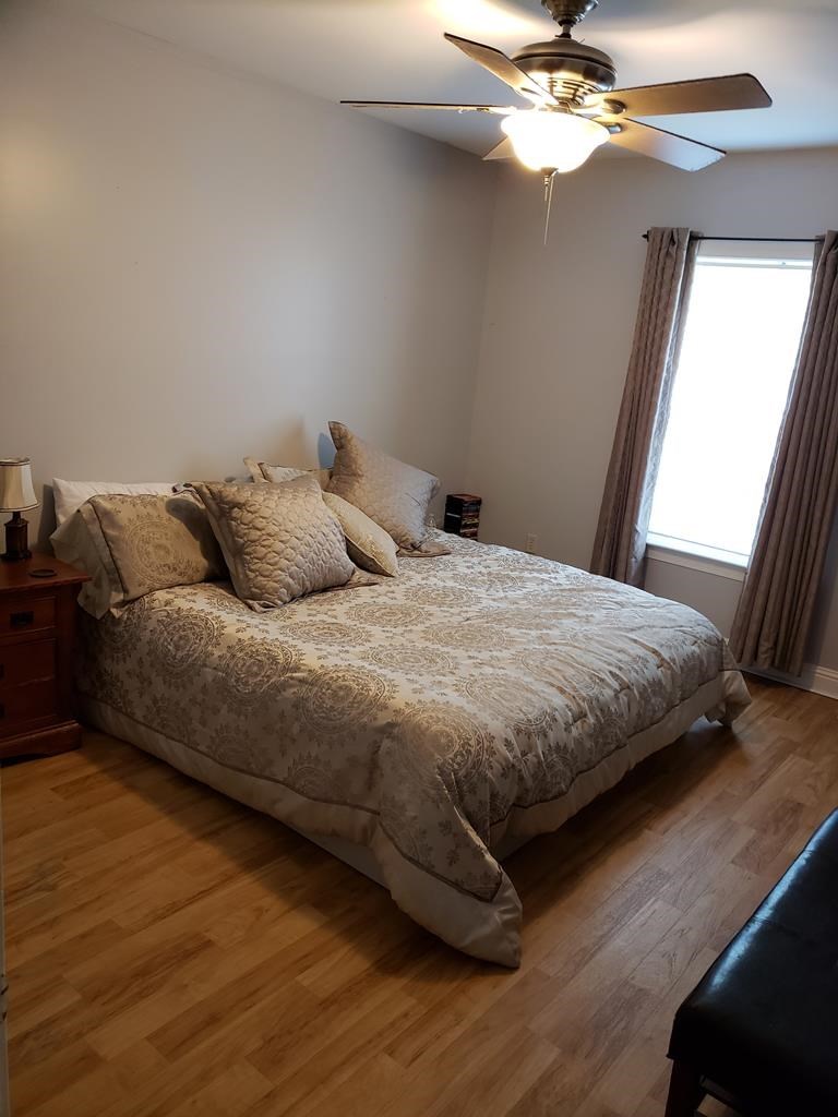 20 Lower Simmons Road Macon, GA 31220 - Photo 22 of 32 a bedroom with a bed and a ceiling fan