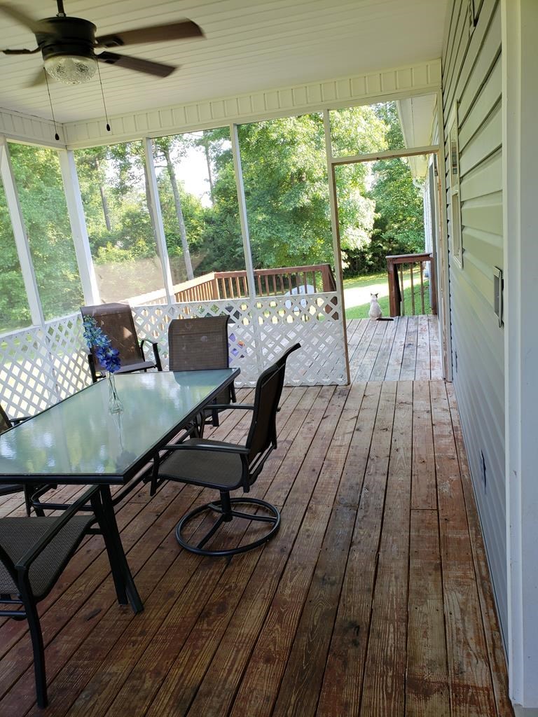 20 Lower Simmons Road Macon, GA 31220 - Photo 25 of 32 a view of a porch with furniture and wooden floor