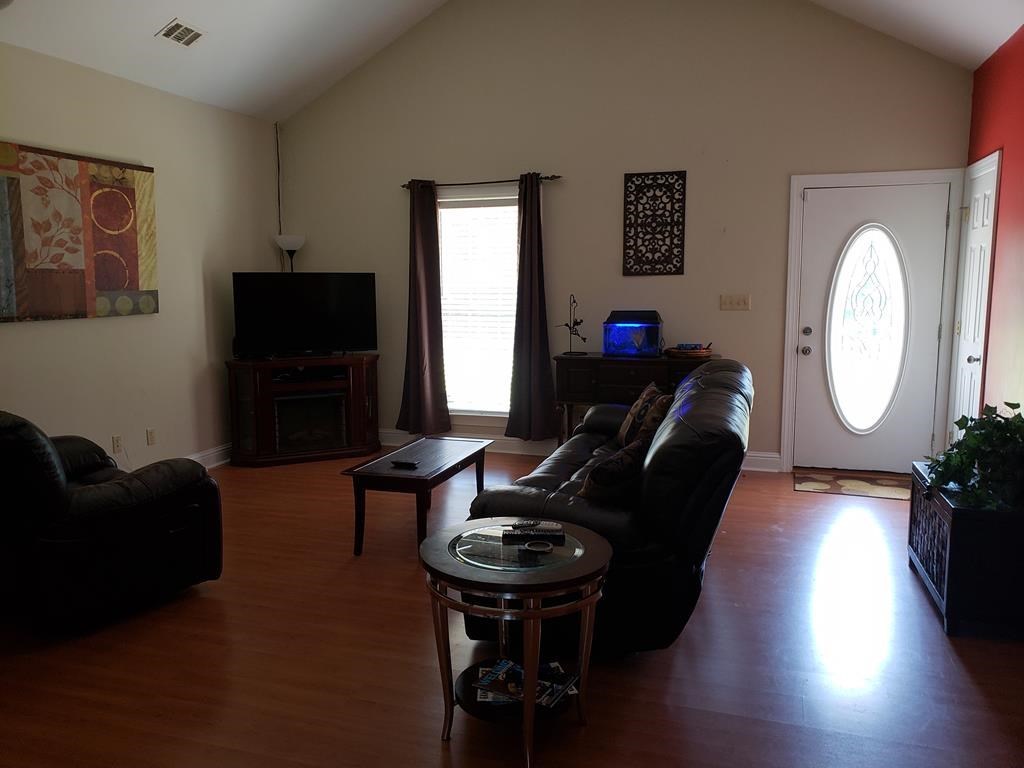 20 Lower Simmons Road Macon, GA 31220 - Photo 7 of 32 a living room with furniture and a flat screen tv