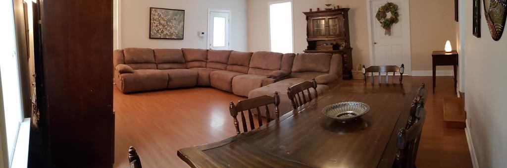 20 Lower Simmons Road Macon, GA 31220 - Photo 9 of 32 a living room with furniture and wooden floor