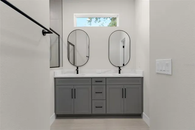 a bathroom with a shower and a sink