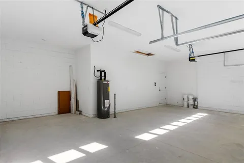 a view of a room with floor to ceiling windows and a yard