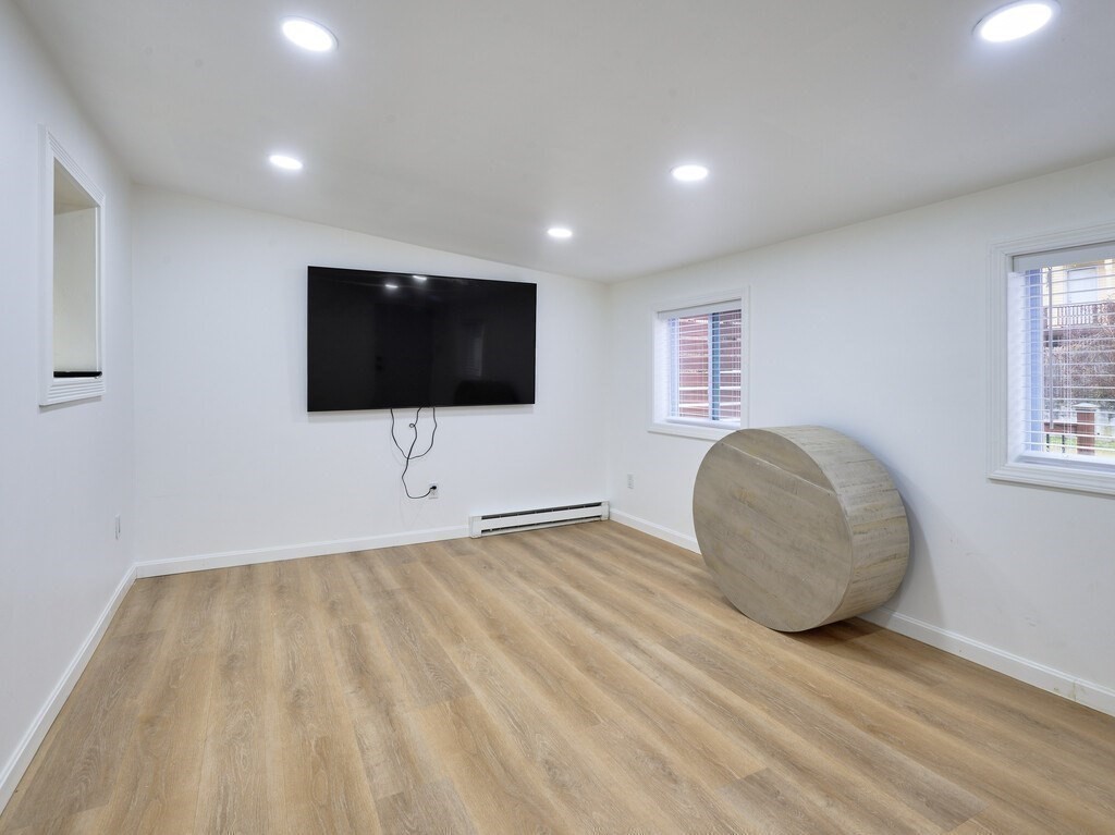 29 Dillon Street Worcester, MA 01604 - Photo 17 of 22 a living room with furniture and a flat screen tv