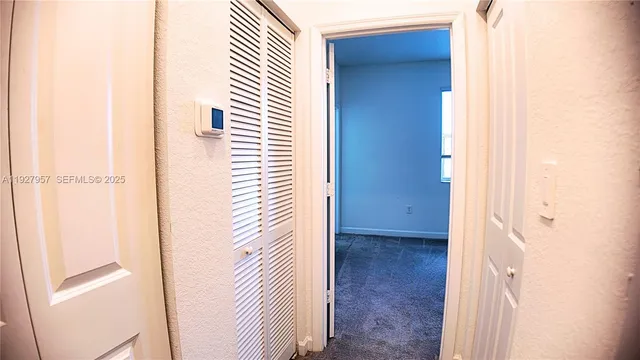 a view of a bathroom from a hallway