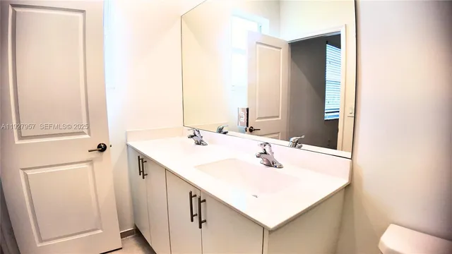 a white sink sitting next to a white sink
