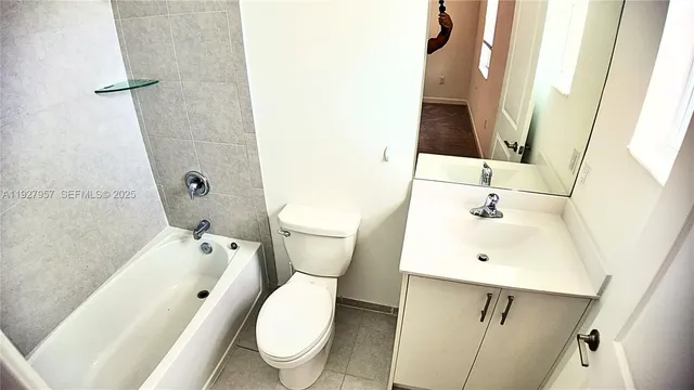 a backyard of a house with green landscape