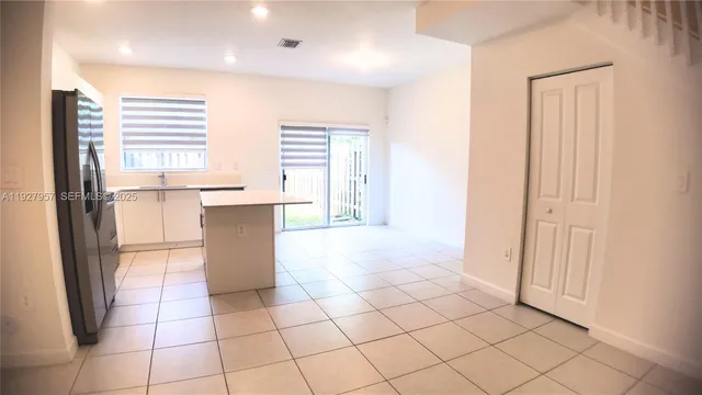 a kitchen with stainless steel appliances a refrigerator and a sink
