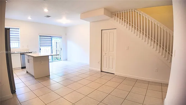 a view of kitchen with furniture and wooden floor