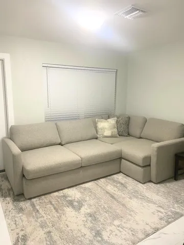 a living room with a couches and a coffee table