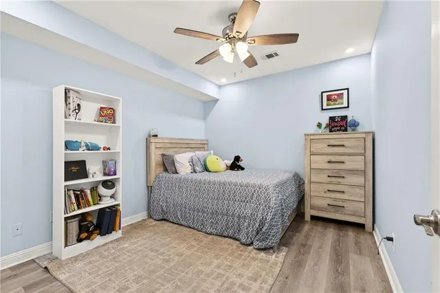 a bedroom with a bed and closet