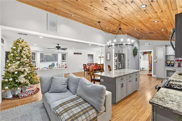 a living room with furniture and flowers