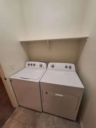 a bathroom with a tub a sink and a shower