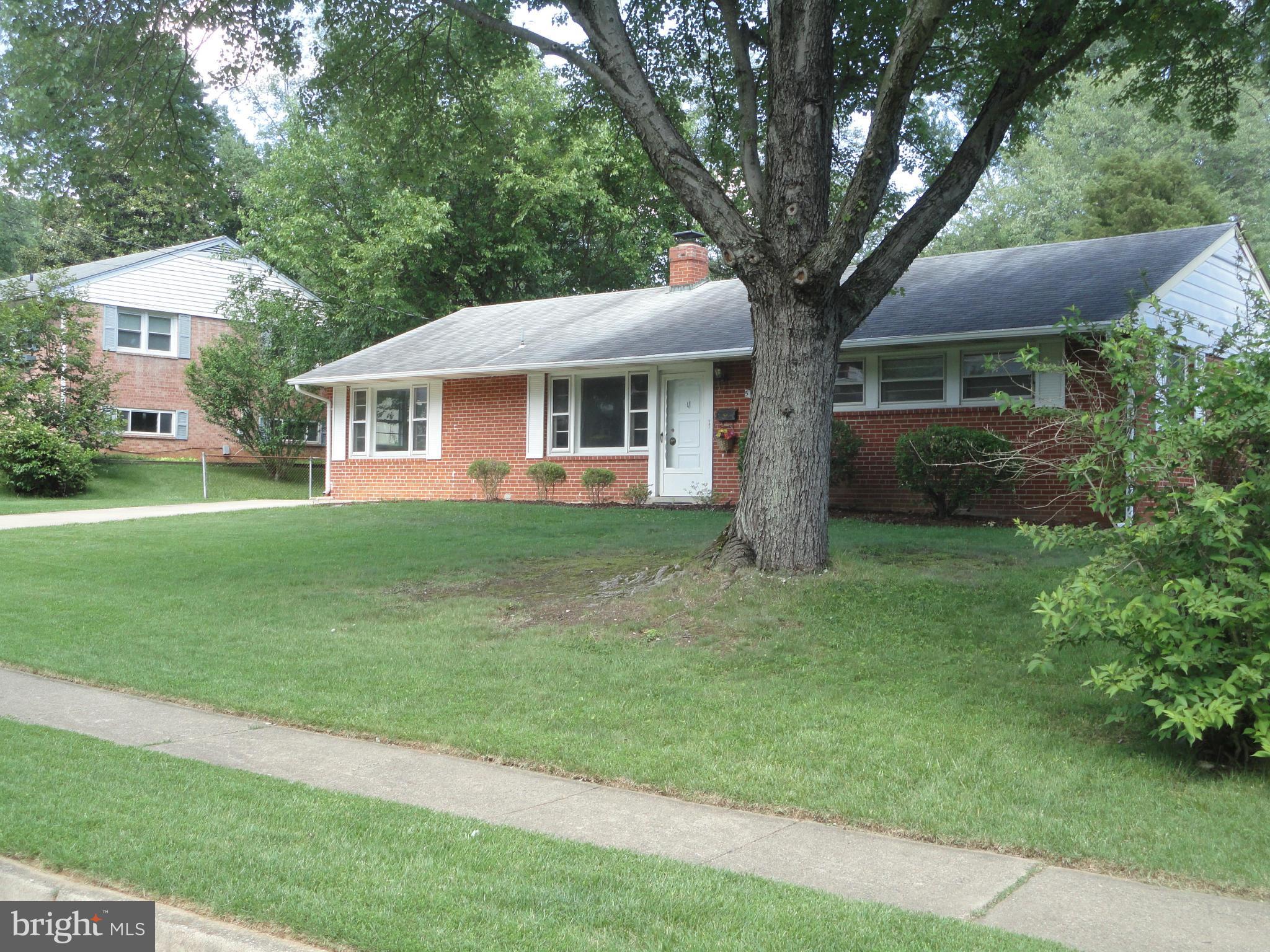 5512 Moultrie Road Springfield, VA 22151 - Photo 2 of 27 a front view of house with yard and green space