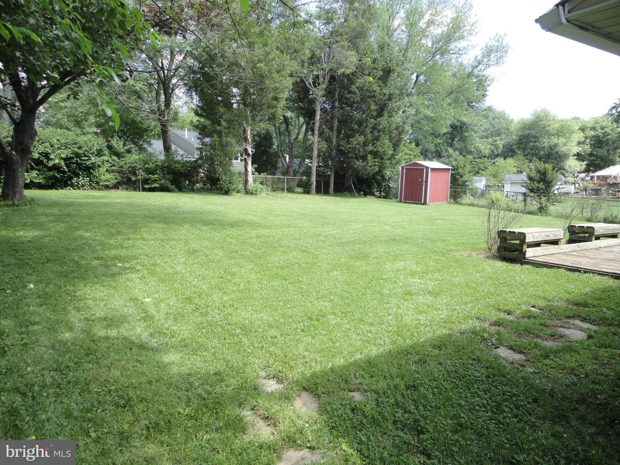 5512 Moultrie Road Springfield, VA 22151 - Photo 11 of 27 a view of a garden with trees
