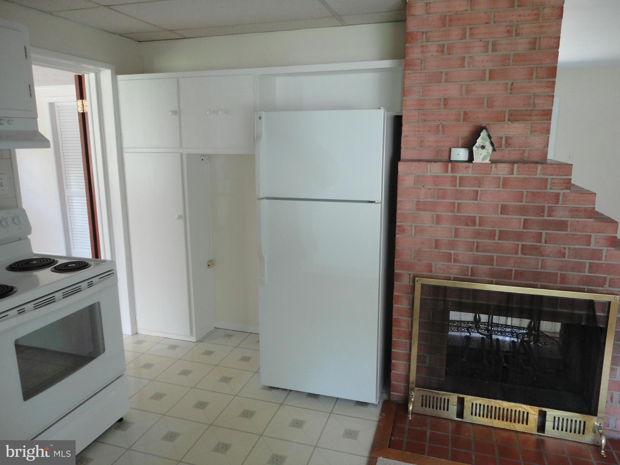 5512 Moultrie Road Springfield, VA 22151 - Photo 16 of 27 a stove top oven sitting inside of a kitchen
