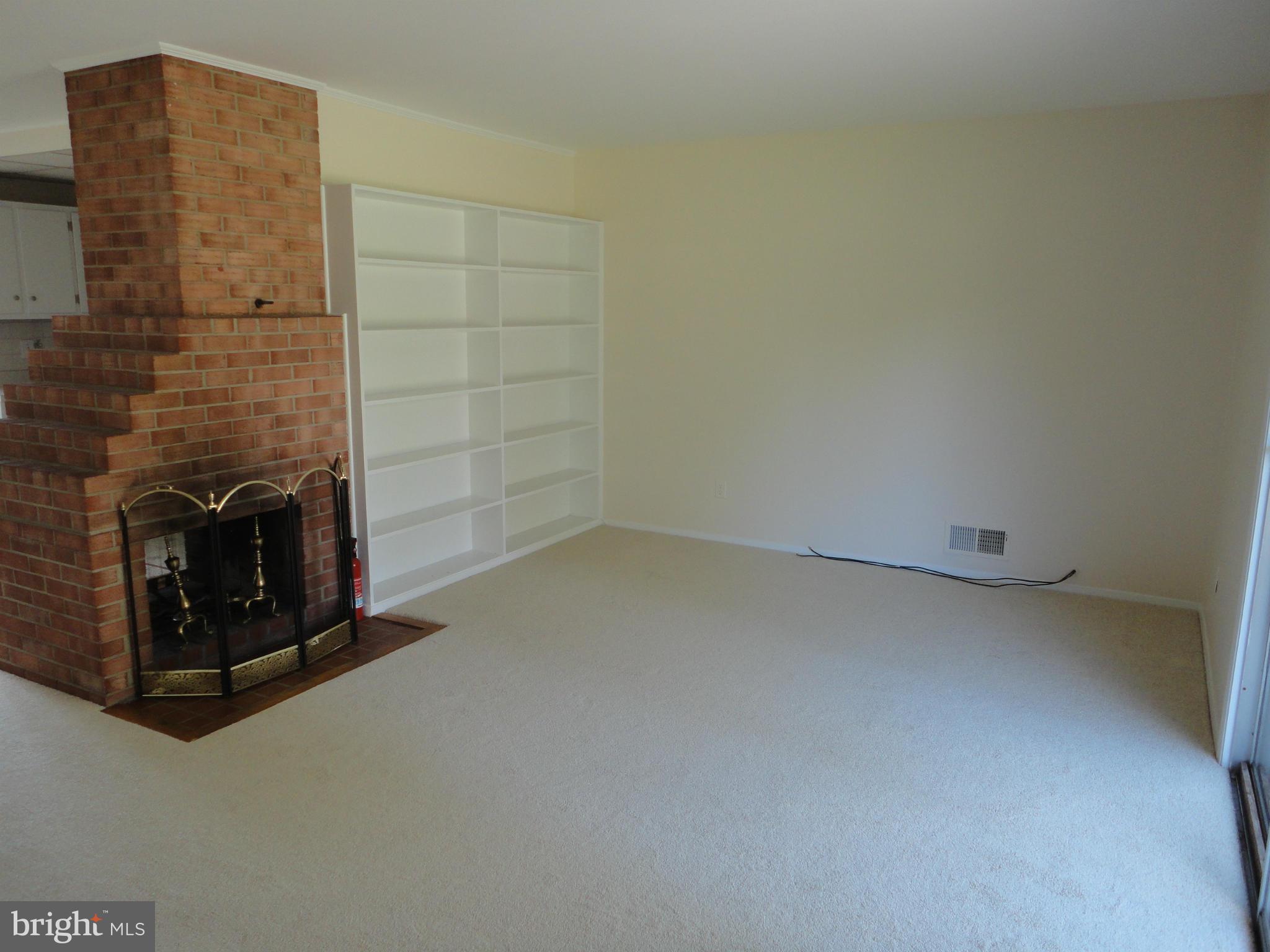 5512 Moultrie Road Springfield, VA 22151 - Photo 18 of 27 a view of an empty room and fire place