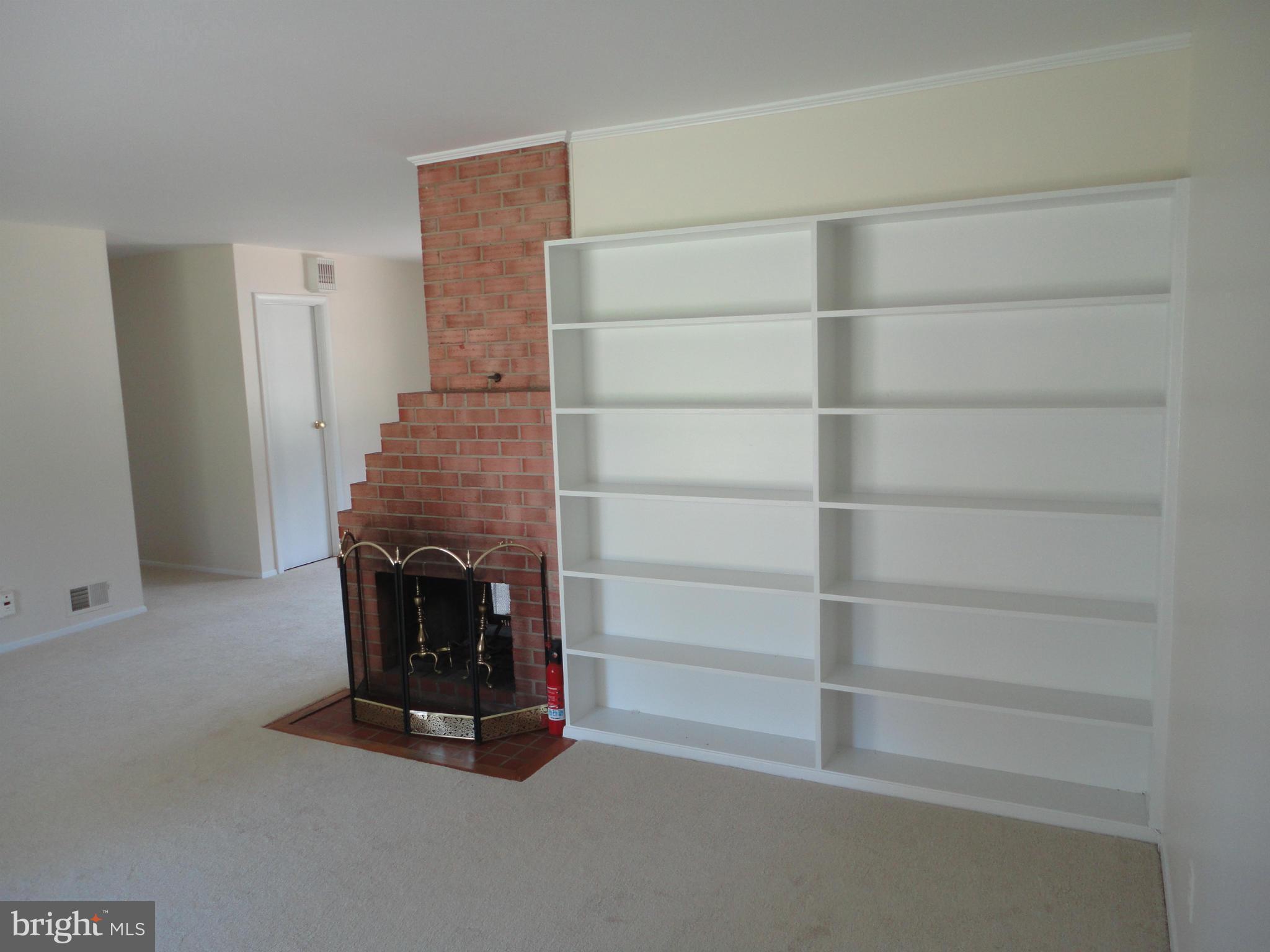 5512 Moultrie Road Springfield, VA 22151 - Photo 19 of 27 a view of walk in closet with empty racks