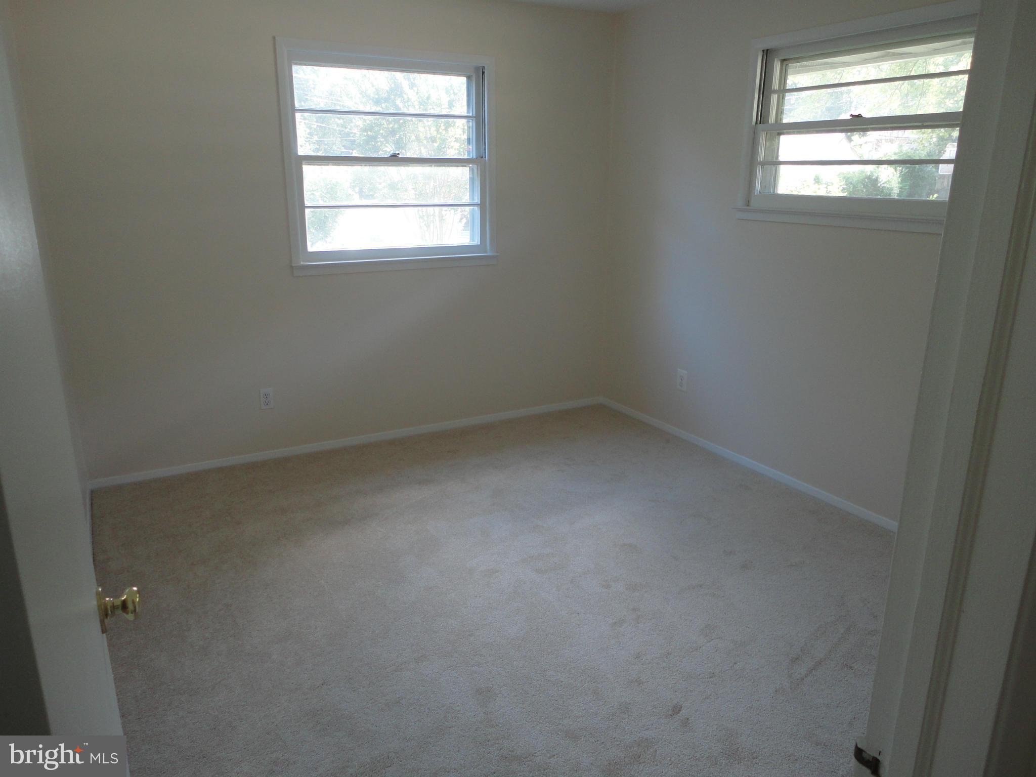5512 Moultrie Road Springfield, VA 22151 - Photo 22 of 27 an empty room with a window