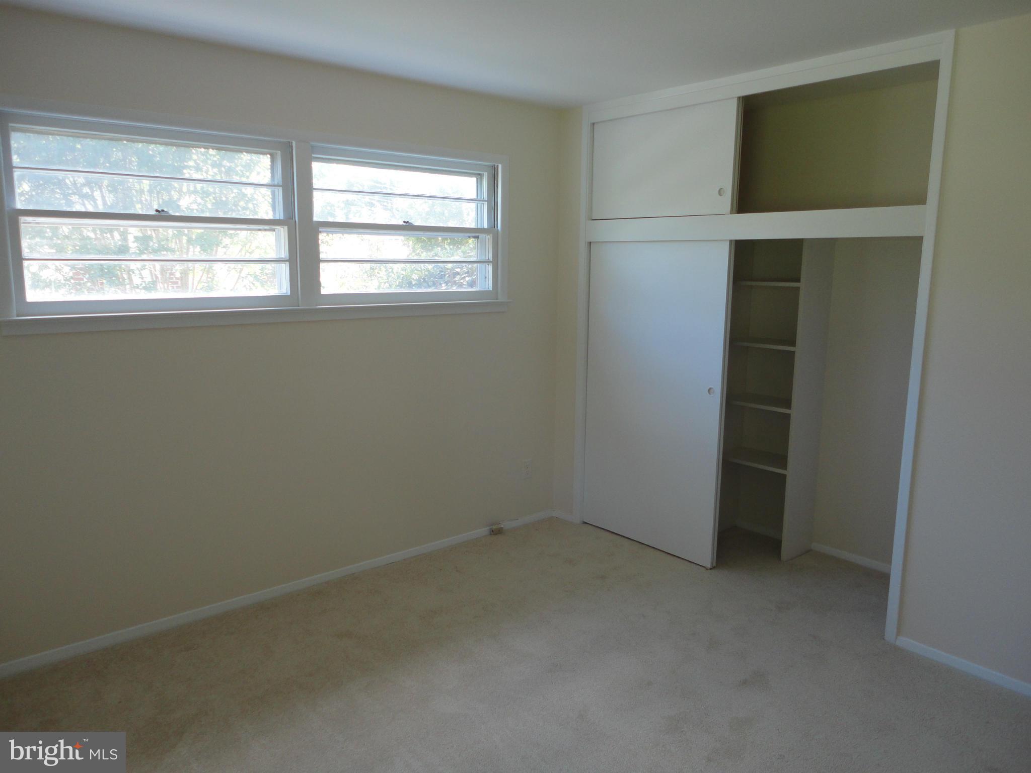 5512 Moultrie Road Springfield, VA 22151 - Photo 23 of 27 an empty room with a window