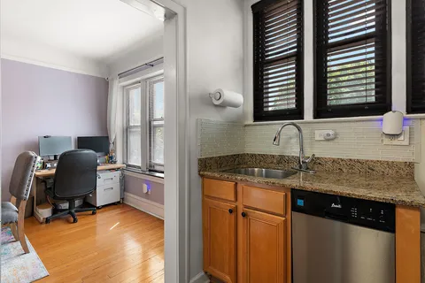 a view of a kitchen with appliances and workspace